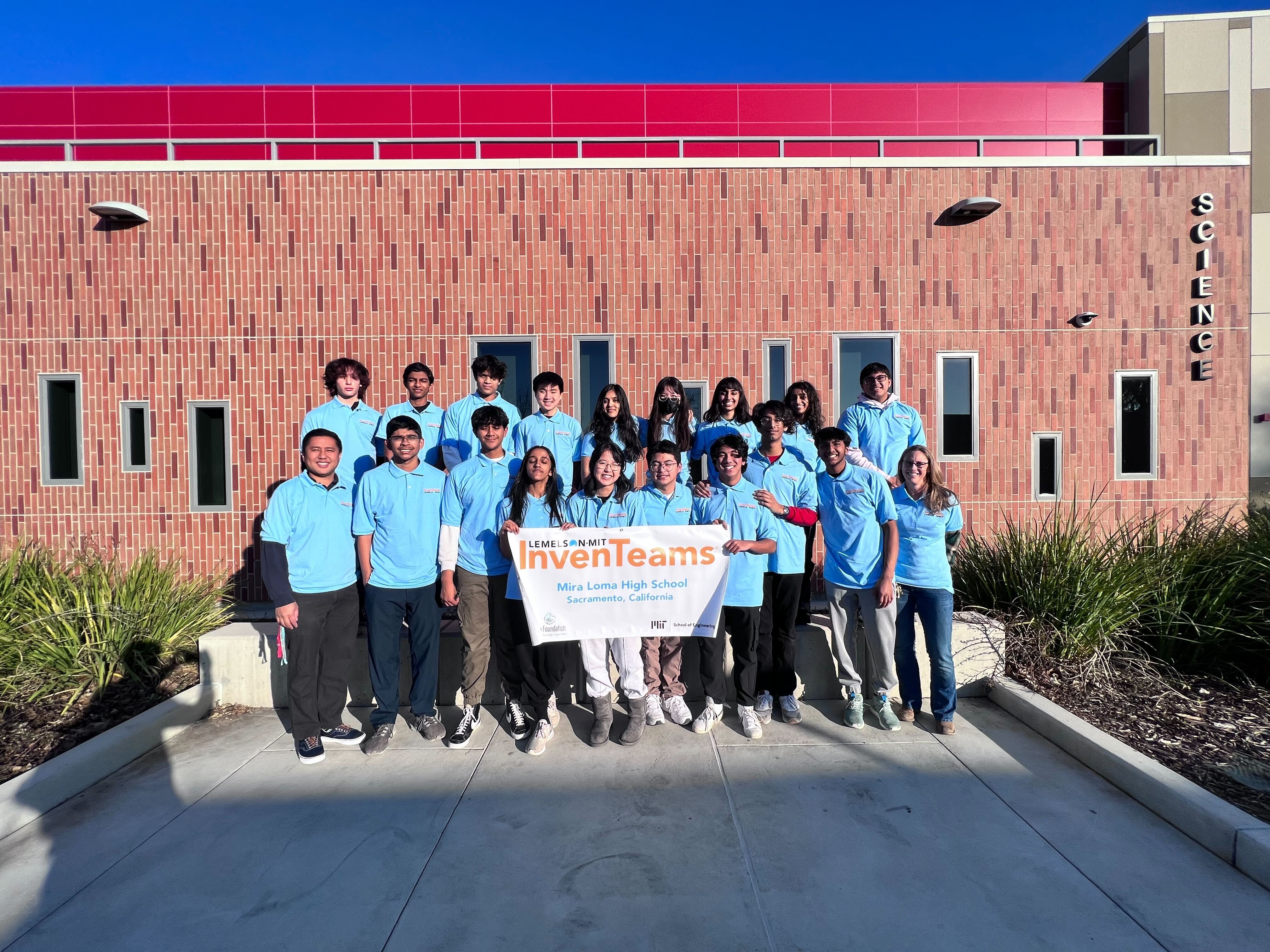 The Mira Loma HS InvenTeam stands with advisors, Franco Canet and Colleen Kelly, for a team photo.