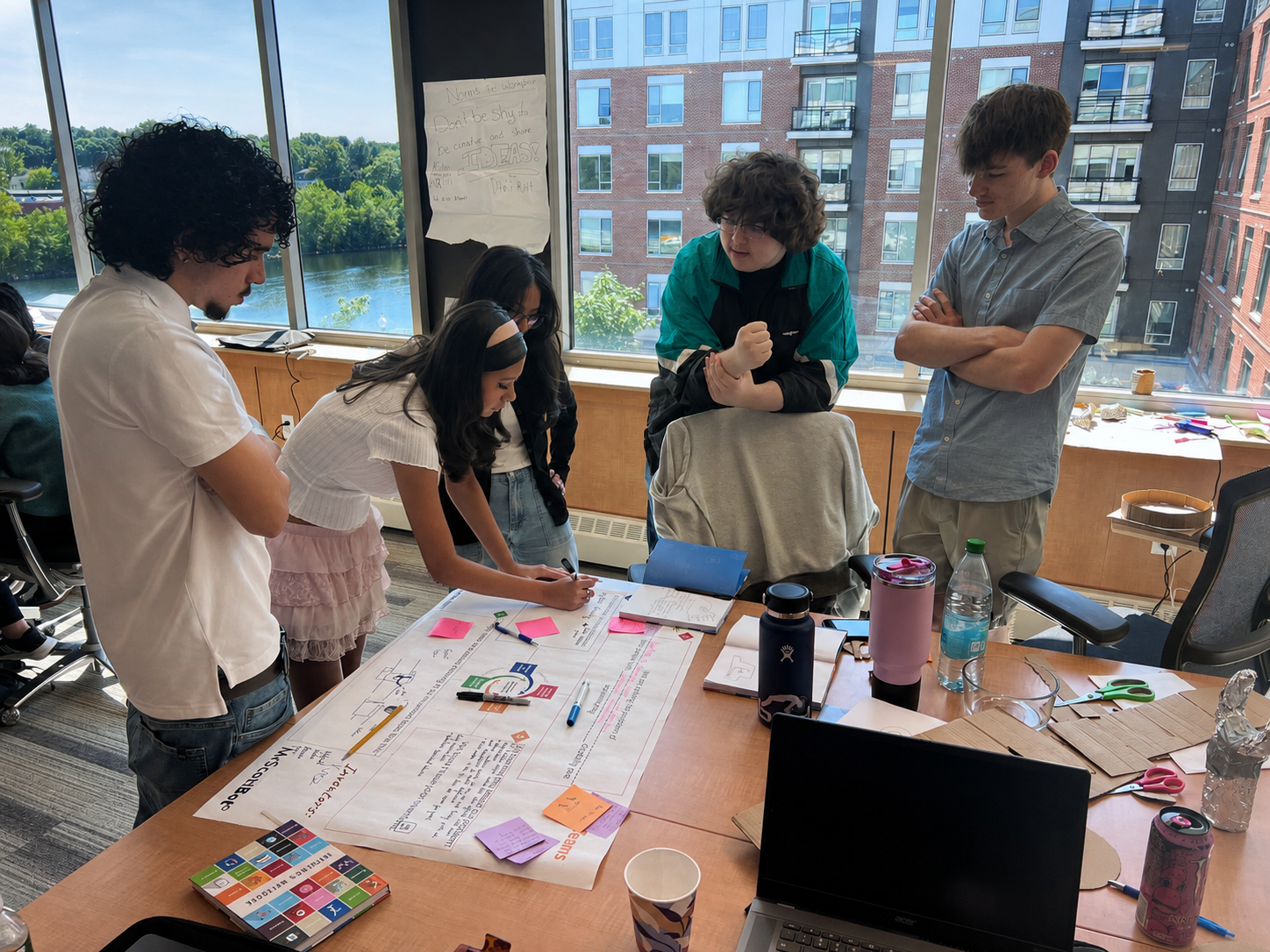 Students working collaboratively on a clean energy project.