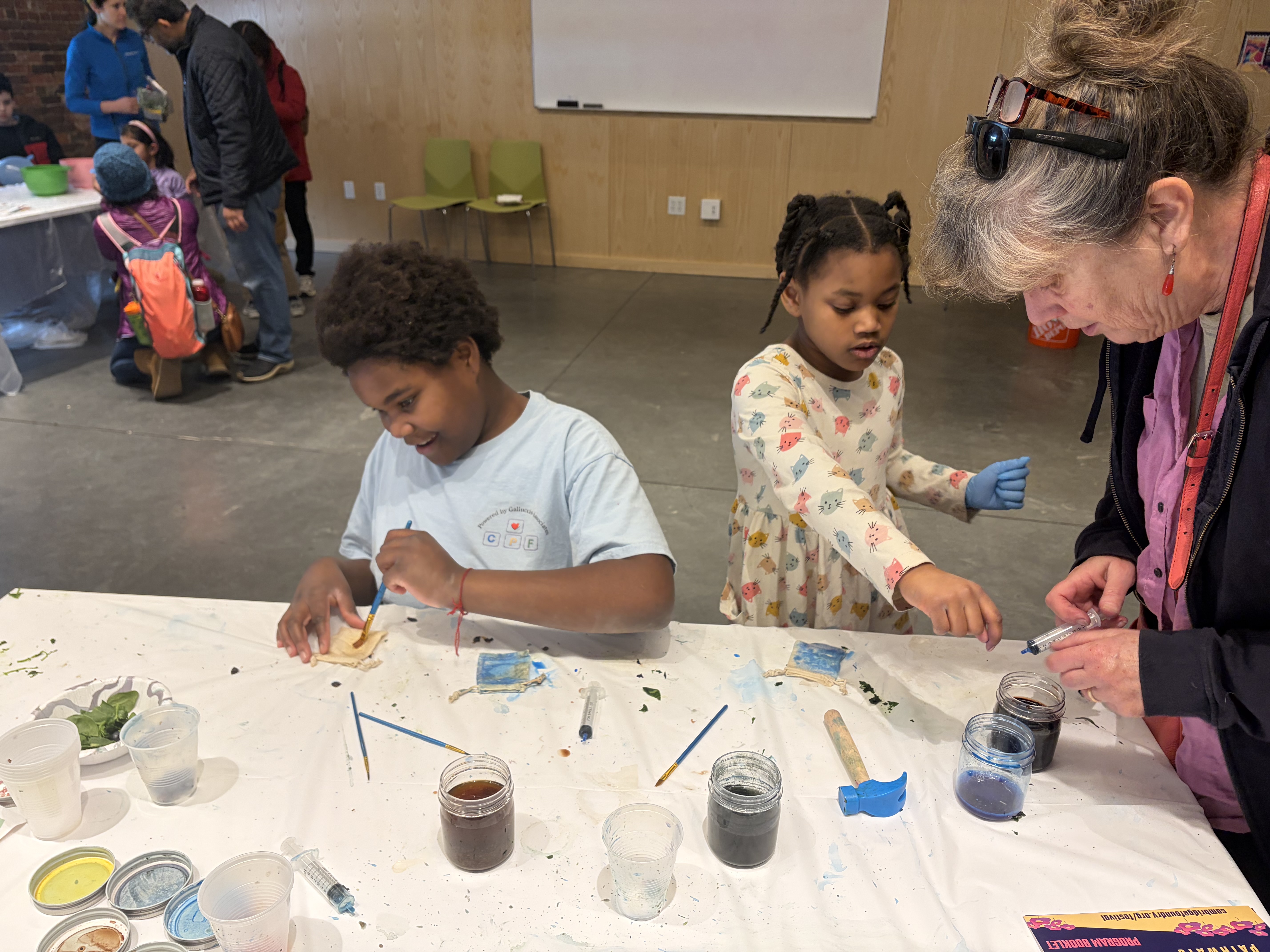 Boy and girl dyeing bags