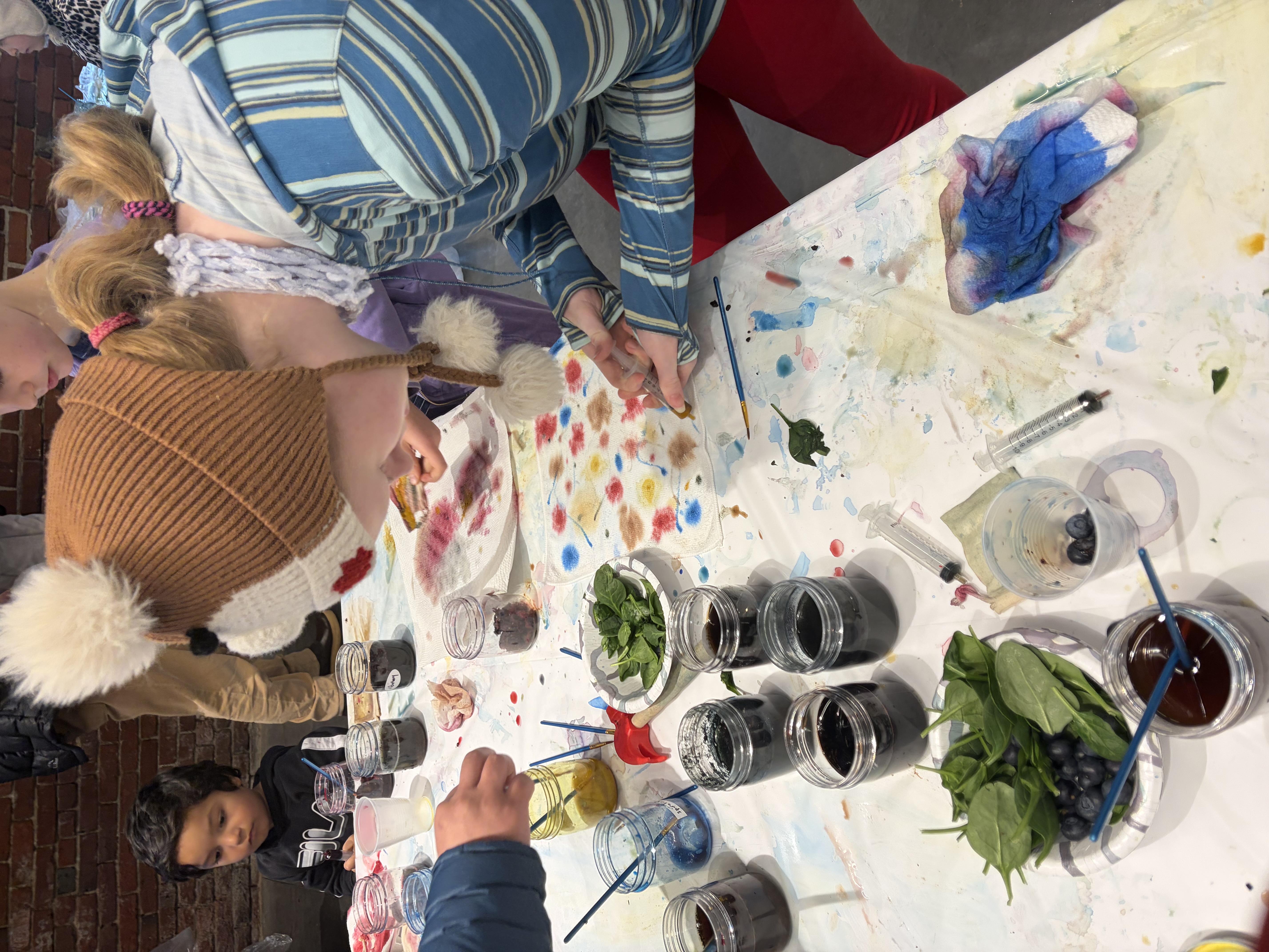 Teen girl using a syringe to apply dye