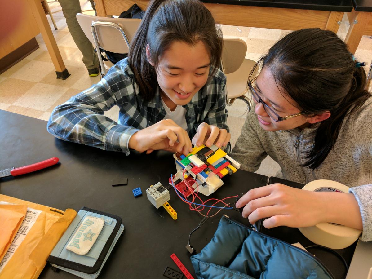 Grace Tang and Grace Kim building a intake prototype out of legos