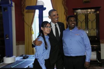 President Obama poses for a photo with Karen Fan and Felege Gebru