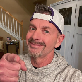 Picture of Kevin Schoedinger in a backward baseball cap