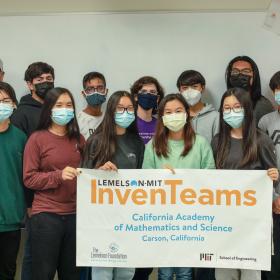 CA Academy of Mathematics & Science InvenTeam with their banner