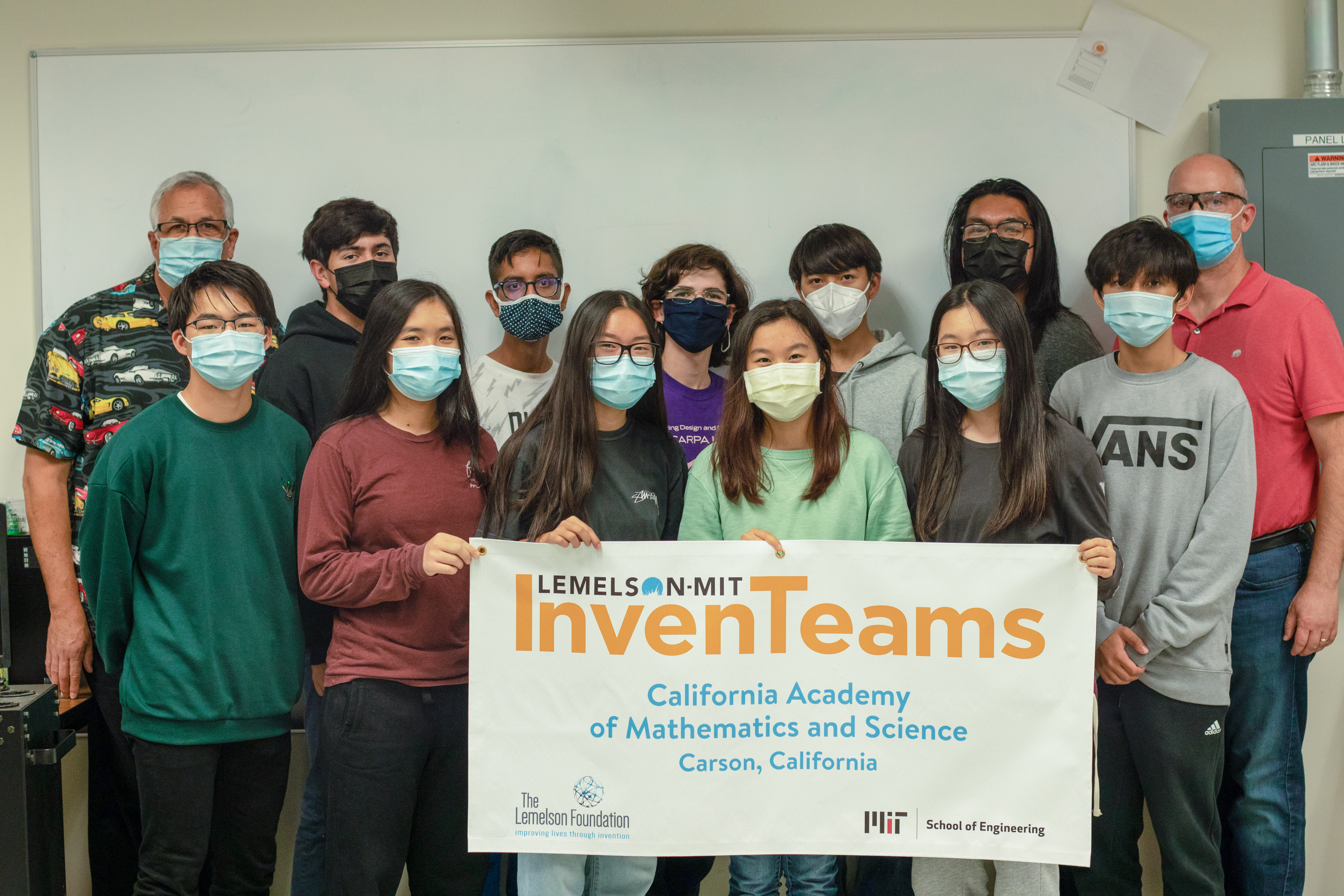 CA Academy of Mathematics & Science InvenTeam with their banner